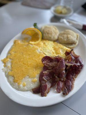 I ordered beef bacon with scrambled eggs, grits with cheese, and homemade buttered biscuits.