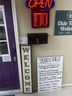 An open sign and a locked door.