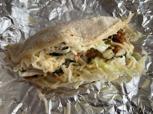 Spiced ground pork taco with everything. Delicious.