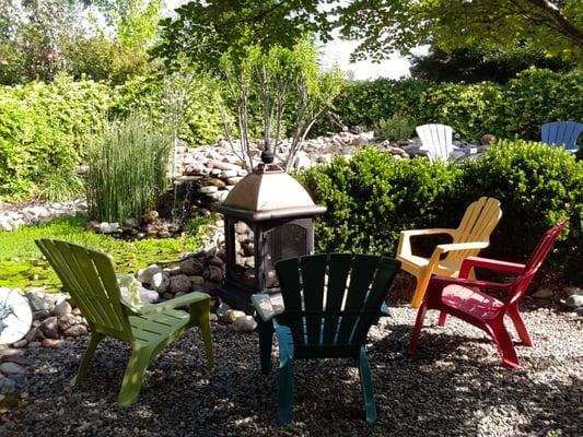 Seating area around pond in back yard
