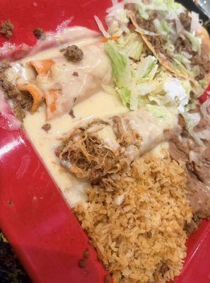 Soggy Flauta, ground beef enchiladas, soggy Tostada smothered in white cheese sauce(was not disclosed on menu that is comes smothered )
