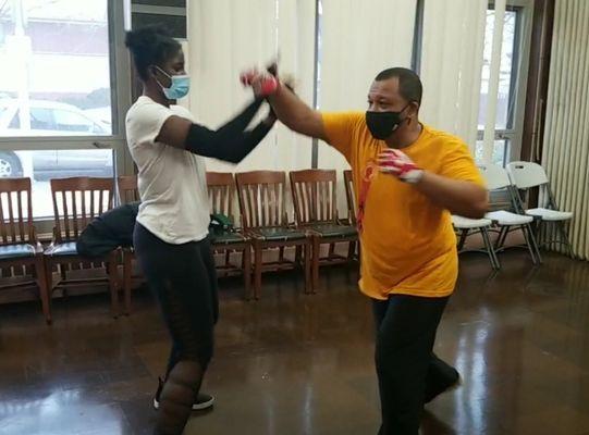 Is this training, Sheridan is stopping a curved straight punch to her face, so she can counteract my next punch.