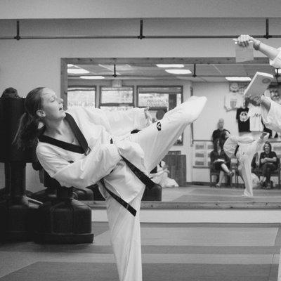 Breaking wood at our "Belt Tests" (Belt tests are to see what you have learned and get promoted to the next level)