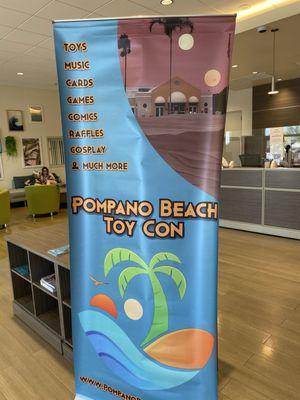 Pompano Beach Toy Con sign.