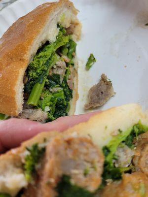 Tender sweet and spicy sausage, garlic and broccoli rabe. Tasty sandwich on a fresh role. I could taste the love.