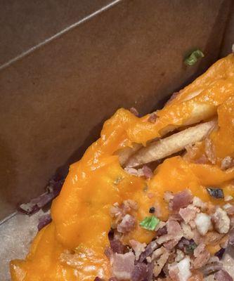 Loaded cheese Loaded Fries with (American) and Cheddar is advertised. Terrible service