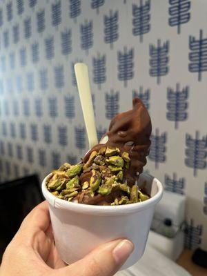 Vanilla soft serve with Tahini chocolate shell and pistachios