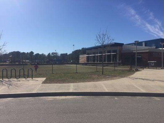 A view of the schoolhouse and playground from the bus drop off point.
