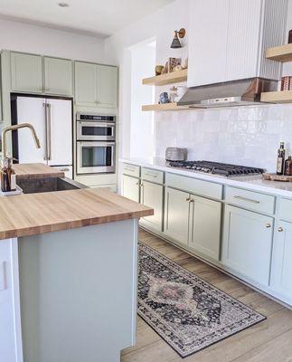 Custom maple butcher block and matching floating shelves.