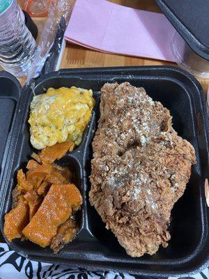 Fried pork chops, mac and cheese and candied yams.,