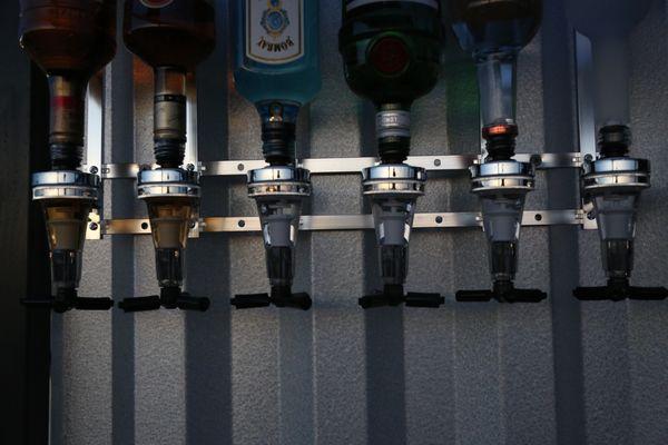 Pre measured shot dispensers