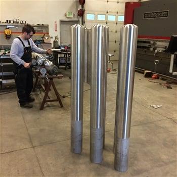 Embedded stainless steel 6" schedule 40 bollard with dome cap