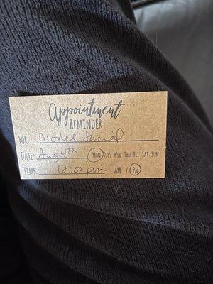 Card for facial appointment on Mon 8/4 @ 12:00, which Marie wrote.
