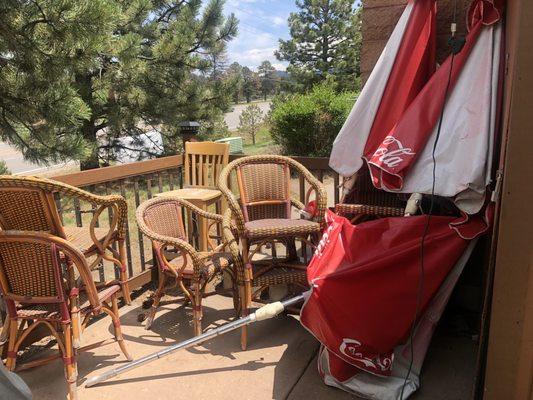 Junk in the corner of the patio that need thrown away.