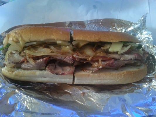 Roast Pork with broccoli rabe, sharp provolone, and fried onions. As good as Dinic's in Philly.