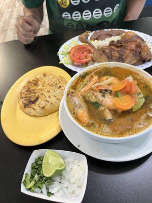Pupusa, seafood soup, fried chicken platter