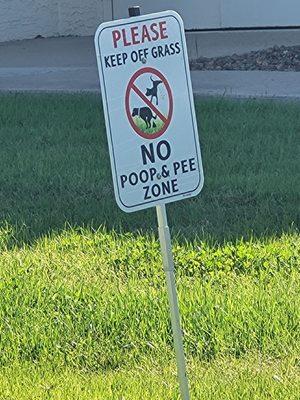 Photo taken Thanksgiving '24. Pets aren't allowed to do their business on community grass areas. These signs are everywhere. Watch for fines