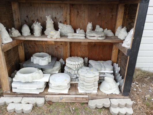 Cement stepping stones and garden figures