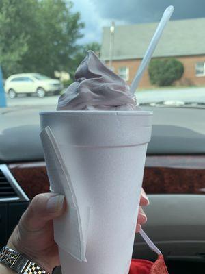 Large raspberry soft serve in a cup.