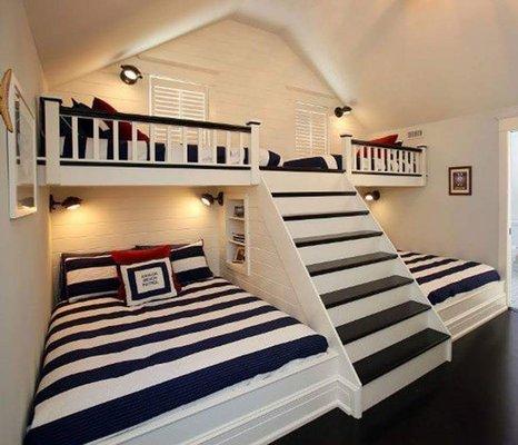 Custom designed and built bunk beds with shelves and hideaway storage