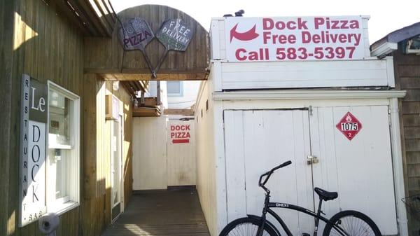 Pizza place is behind Le Dock restaurant.