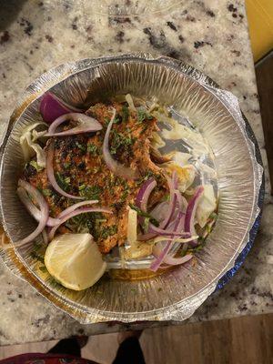 This is what you get here for $18.71 plus tax. The photo shows a full container. We got one thin slice of fish. Period.