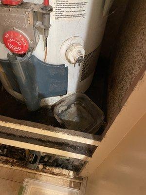 Old water heater where water was leaking from.