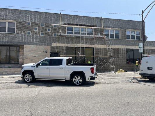 Here is a photo of montes roofing llc doing a entire Tuckpoint and bricks replaced