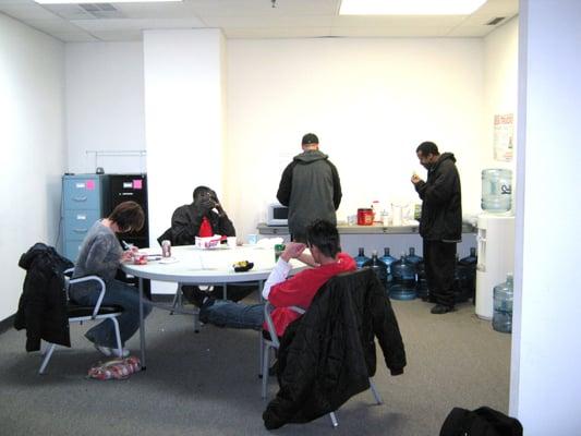 The economy break room. There's another large round table and vending machines, in the room next door.