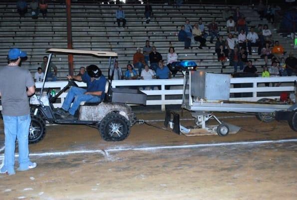 Darryl shows what an EZ Go Golf Cart can do at a local Tractor pull.