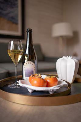 A warm welcome! This thoughtful amenity was waiting in my room--champagne, fresh persimmons, and a beautiful setup.