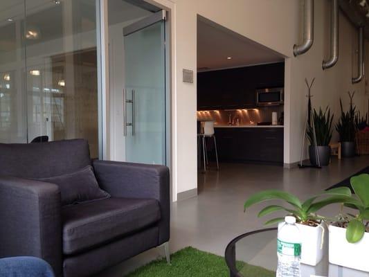 Kitchen where cooking and eating healthy classes are held and couch room for talks and chats