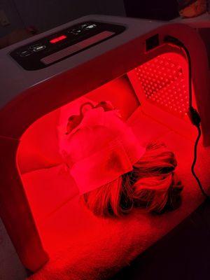Red LED therapy to stimulate collagen and healing.
