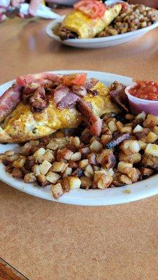 Bacon and cheddar omlette with home fries. Not pictured was a side of toast and the best sausage gravy I think I've ever had.
