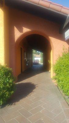 You can enter from the front or the back.