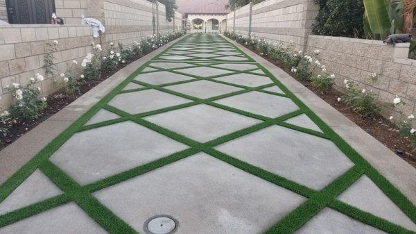 Exposed aggregate color concrete with band around perimeter and diamond cut in the inside.