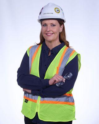 Smiling woman in Hard Hat & Vest