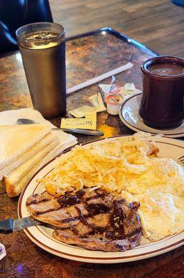 10/2/23 Steak and eggs little splash A1 eggs over medium white toast hash browns lightly done. Cawfee