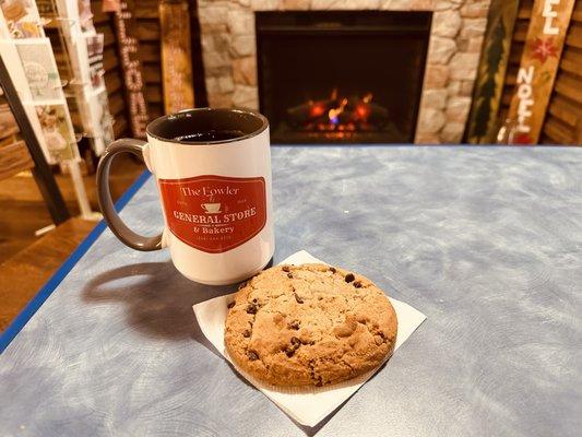 Fresh baked chocolate chip cookie and hot coffee