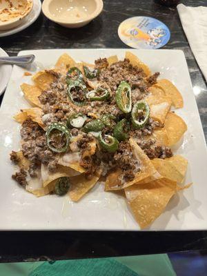 Beef and bean nachos with grilled fresh jalapeños. So much more flavor than any other Mexican restaurant around.