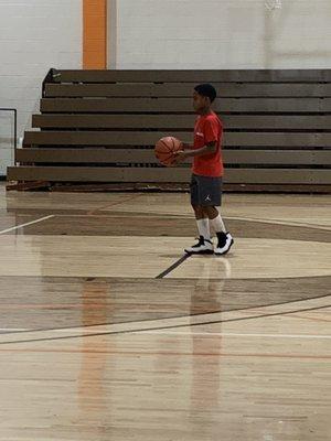 My grandson making a shot