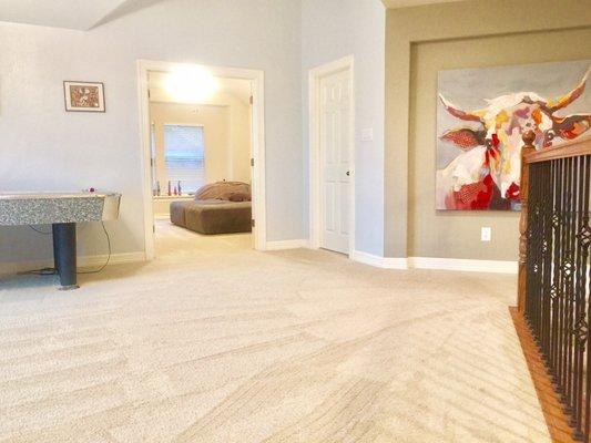 Walking from the loft to media room you'd see slack in the carpet by the double doors. Now it's flat and tight!