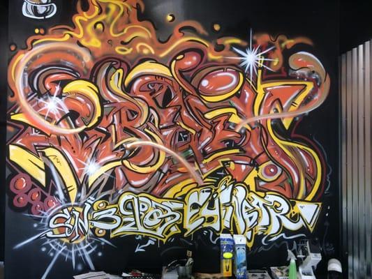 Very cool graffiti on the back wall of the store