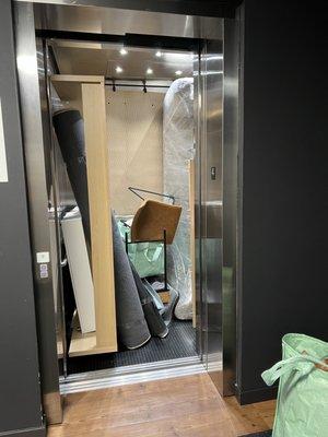Jenga our items into the apartment complex elevator