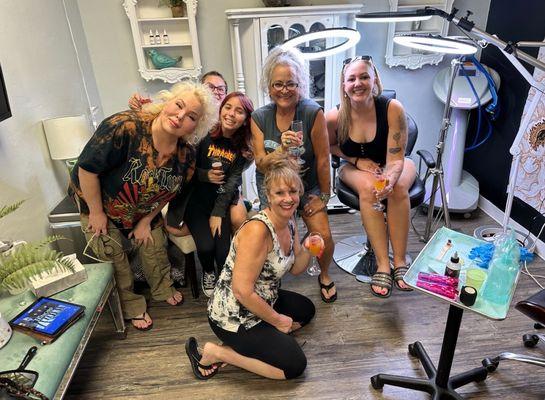 mothers and daughters getting matching tattoos, my granddaughter and our tattoo artist on the left....
