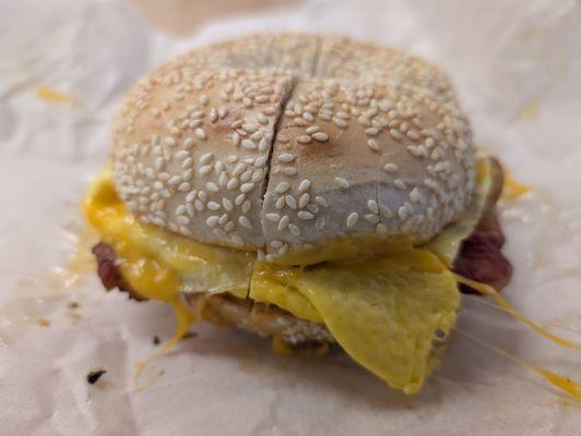Sesame bagel eggs, bacon and cheese.