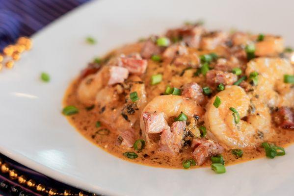 Mardi Gras Shrimp & Grits - pork belly, jumbo shrimp, and our spicy New Orleans butter and cream