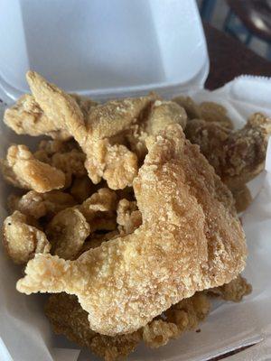 Chicken cracklins, fried chicken skins.