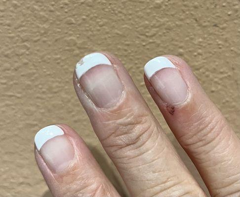 10/19 one day after they did the redo that they charged me for, this is the cut from them doing my cuticles and the paint chip.