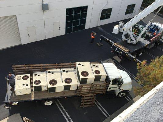 Removing old commercial equipment and upgrading the customers equipment to more energy efficient units.